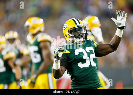 Green Bay Packers' Chris Banjo (32) and Aaron Ripkowski (22) fire up the  crowd after a kickoff return against the Washington Redskins during the  second half of their NFC Wild Card game