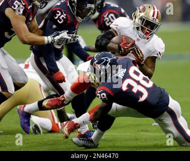 San Francisco 49ers LaMichael James (23) eludes Miami Dolphins Jonathon  Amaya (29) in the third quarter