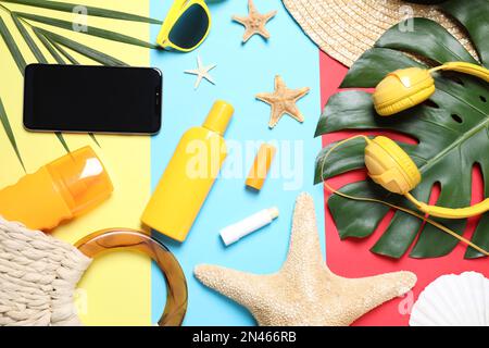 Flat lay composition with beach objects and smartphone on color background Stock Photo