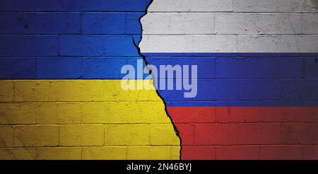 Cracked brick wall painted with a Ukrainian flag on the left and a Russian flag on the right. Stock Photo