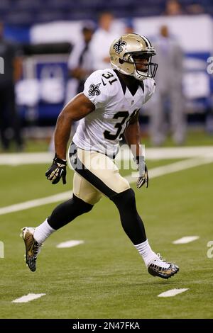 New Orleans Saints free safety Pierre Warren (42) returns an interception  for 33 yards that was thrown by New England Patriots quarterback Jimmy  Garoppolo during the fourth quarter at the Mercedes-Benz Superdome