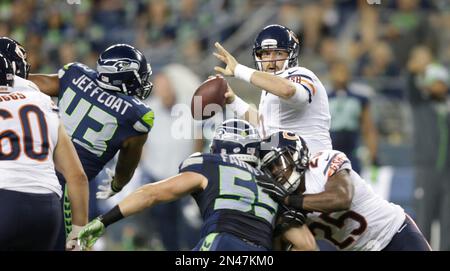 Seattle Seahawks linebacker Heath Farwell (55) sacks Chicago Bears  quarterback Jordan Palmer in the third quarter of a pre-season game at  CenturyLink Field in Seattle, Washington on August 22, 2014. The Seahawks