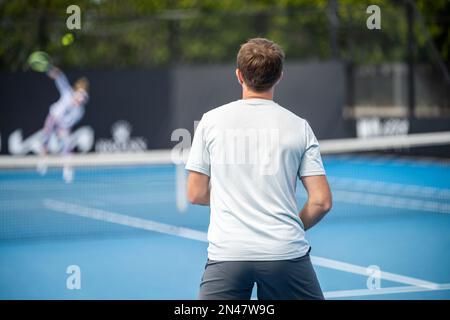 Beautiful female athlete playing tennis. Amateur female tennis player hitting a forehand playing tennis Stock Photo