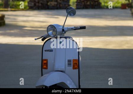 Close-up image of a Piaggio Vespa, parked in the driveway of a house in Italy. 02-01-2023 Florence Tuscany Italy Stock Photo