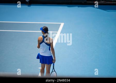 Beautiful female athlete playing tennis. Amateur female tennis player hitting a forehand playing tennis Stock Photo