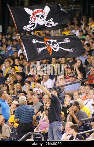A Pittsburgh Pirates fan waves a Jolly Roger during the opening day  baseball game between the Pittsburgh Pirates and the St. Louis Cardinals at  PNC Park in Pittsburgh, Sunday, April 3, 2016.