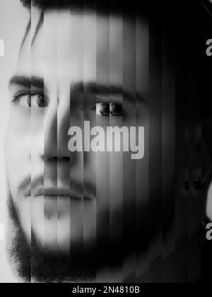 Abstract portrait of a bearded man made with random cutouts. Deformed portrait of a young man. Man face closeup with glitch effect. Black and white po Stock Photo