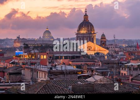 Rome, Italy rooftop skyline at dusk with the Vatican in the distance. Stock Photo