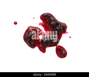 Abstract liquid stain of sweet black currant jam or sauce isolated on white, top view Stock Photo