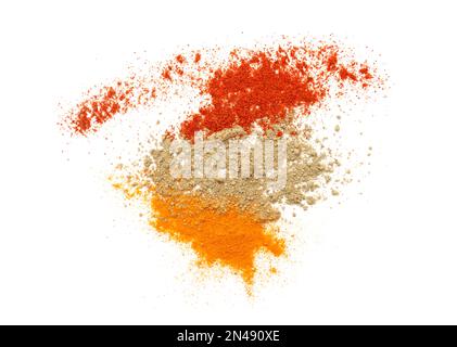 Set of three kind of dried seasoning turmeric or curcuma, pepper and paprika isolated on white, top view Stock Photo