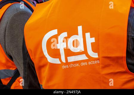Logo of the French trade union organization CFDT (French Democratic Confederation of Labor) on an orange vest photographed during a demonstration Stock Photo