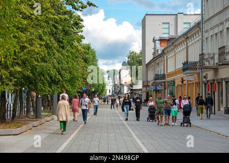 KAUNAS - JULY 08: People walking along the Laisves aleja or Liberty Boulevard during warm summer day in Kaunas on July 08. 2022 in Lithuania Stock Photo