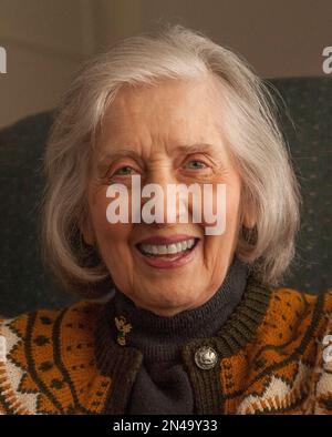 Retired mother and daughter spend time together at home, playing board