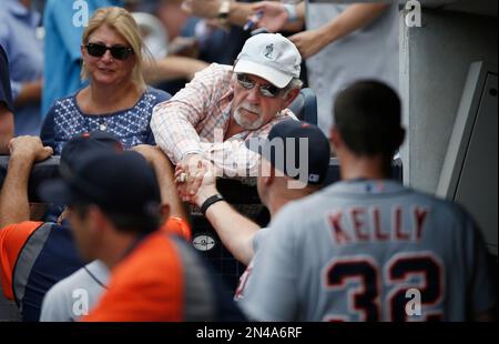 A fan of former New York Yankees outfielder and designated hitter Hideki  Matsui wears a jersey bearing his nickname Godzilla while taking  photographs of batting practice at Yankee stadium before a baseball