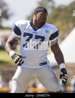 Dallas Cowboys tackle Tyron Smith (77) participates in drills