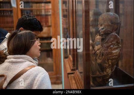 Visitors surprised with mummy of a girl and a boy at The Carmo Archaeological Museum (MAC), located in Carmo Convent, Lisbon, Portugal Stock Photo