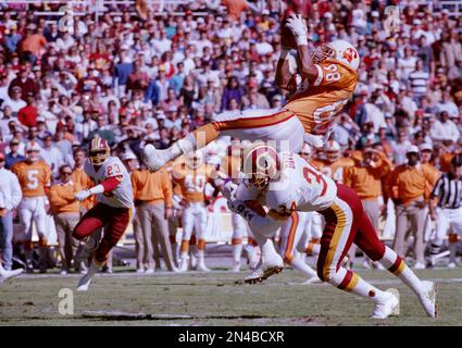 Washington Redskins cornerback Brian Davis pounds his helmet while sitting  on the bench during the fourth quarter against the San Francisco 49ers in  Candlestick Park, San Francisco, Sept. 17, 1990. The 49ers