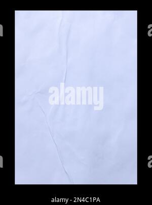 Blank white crumpled and creased sticker glued paper poster texture isolated on black background. Stock Photo