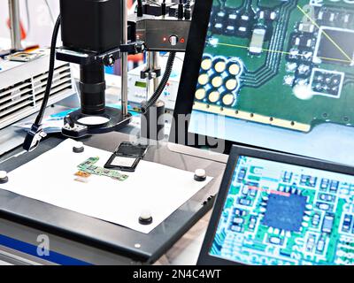 Electronic boards and chips, industrial microscope and monitors Stock Photo