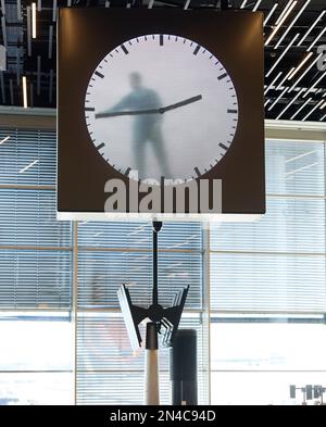 Clock display inside Schiphol Airport, Amsterdam Stock Photo