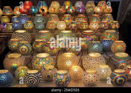 Table lamps decorated with mosaics of various colors for sale in a street market Stock Photo