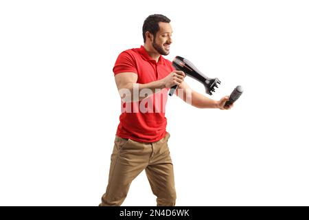 Man working with a hair dryer and a brush isolated on white background Stock Photo