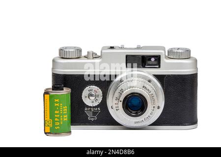 Maryville, Tennessee - February 2, 2023: A 1950s era Argus camera with a roll of Kodak black & white film from the same time period. Stock Photo