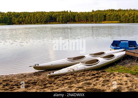 Borowy Mlyn, Poland - August 5, 2021: Recreation pontoons on shore of Jezioro Gwiazdy lake in Bukowo Borowy Mlyn Village of Pomerania in Kashubian reg Stock Photo