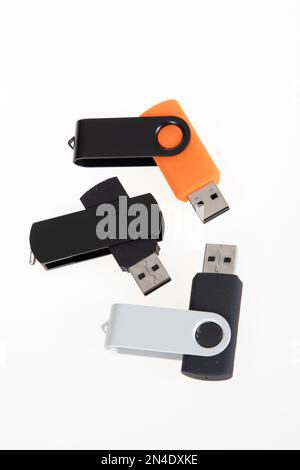 three white USB flash drives on a wooden background Stock Photo - Alamy