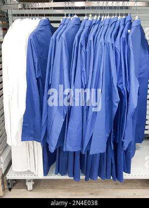 https://l450v.alamy.com/450v/2n4e038/medical-uniform-clothing-on-hunger-in-a-shop-2n4e038.jpg