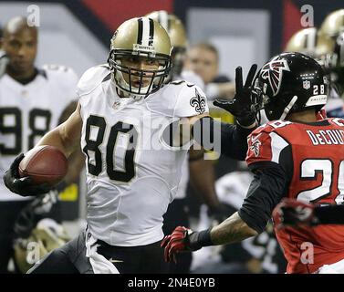 FILE - New Orleans Saints tight end Juwan Johnson (83) attempts to block Cleveland  Browns defensive end Myles Garrett (95) during an NFL football game,  Saturday, Dec. 24, 2022, in Cleveland. As