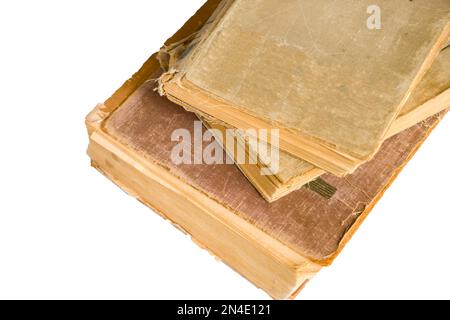 Stack of old antique big books isolated on white background,close up Stock Photo