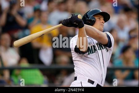 ANAHEIM, CA - JULY 16: Kyle Seager (15) is congratulated after he hit a two  run home run in the third inning against the Los Angeles Angels on July 16,  2021 at