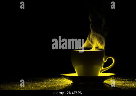 A mug with a warm drink and steam illuminated by yellow light, copy space, creative. Steaming coffee cup on a black background, silhouette. Morning co Stock Photo