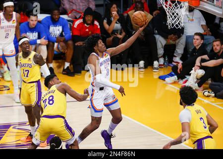 Oklahoma City Thunder guard Jalen Williams (C) drives past Los Angeles Lakers forward Rui Hachimura (28) and goes to basket during an NBA basketball game.Final scores; Thunder 133:130 Lakers Stock Photo