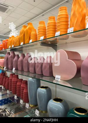 11.12.2022 Ukraine, Kharkiv, gift shop - a set of decorative glass pink vases. Pink glass vase with decorative lines around, isolated Stock Photo