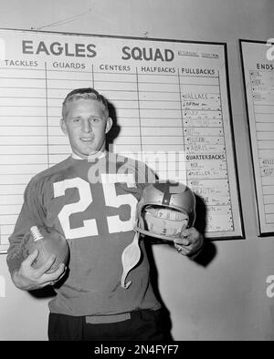 Tommy McDonald, All-America Oklahoma back, poses with a new number, head  gear and ball after he signed with the Philadelphia Eagles, Jan. 14, 1957,  to start a professional career in the NFL.