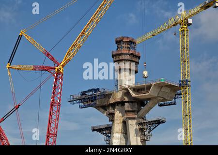 Cranes transporting concrete to main bridge tower, constructing New Corpus Christi Harbor Bridge, Corpus Christi, Texas. Stock Photo