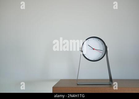 Round clock isolated on white background.  Stock Photo