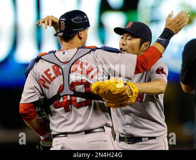 Boston Red Sox closer Koji Uehara holds his son Kazuma as they celebrate on  the field after the Red Sox won the 2013 World Series defeating the St.  Louis Cardinals in game
