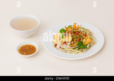 Com hen Hoi An, Vietnamese rice dish with baby basket clams rice, Vietnamese food isolated on white background; perspective view Stock Photo