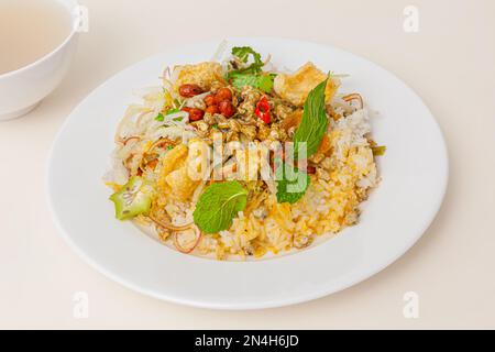 Com hen Hoi An, Vietnamese rice dish with baby basket clams rice, Vietnamese food isolated on white background; close-up