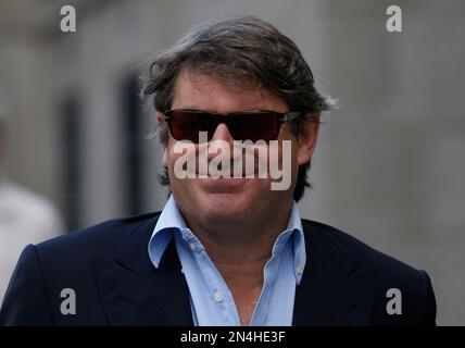 FILE - In this Tuesday, June 17, 2014 file photo, Charlie Brooks, husband of former News International chief executive Rebekah Brooks, arrives at the Central Criminal Court in London where he appeared to face charges related to phone hacking. Former News of the World editor Andy Coulson was convicted of phone hacking Tuesday, June 24, 2014, but fellow editor Rebekah Brooks was acquitted in the trial centering on illegal activity at the heart of Rupert Murdoch's newspaper empire. Three others — Brooks' husband Charles Brooks, her former secretary Cheryl Carter and News International security ch