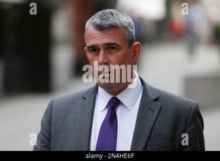 FILE - In this Tuesday, June 17, 2014 file photo, Mark Hanna, former head of security at News International, arrives at the Central Criminal Court in London where he will appear to face charges related to phone hacking. Former News of the World editor Andy Coulson was convicted of phone hacking Tuesday, June 24, 2014, but fellow editor Rebekah Brooks was acquitted in the trial centering on illegal activity at the heart of Rupert Murdoch's newspaper empire. Three others — Brooks' husband Charles Brooks, her former secretary Cheryl Carter and News International security chief Mark Hanna — were a