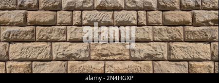 Brown sandstone panoramic wall with a very rough surface Stock Photo