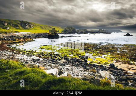 Wild dramatic northern Ireland coast in Ballintoy. Game of thrones filming locations concept. Stock Photo