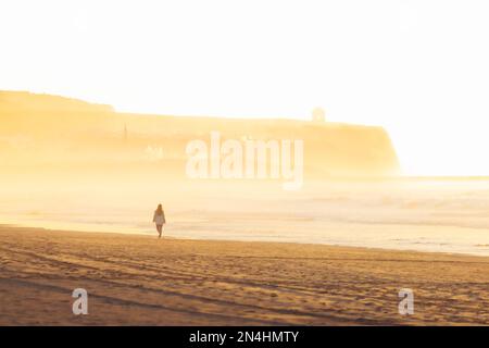 Woman and sunset. Giant´s Causeway, County Antrim, North Ireland ...