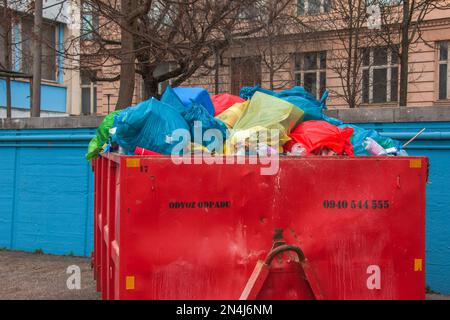 Slovakia, Bratislava - 01.08.2023: Container with garbage on the city street. Ecology concept. Stock Photo