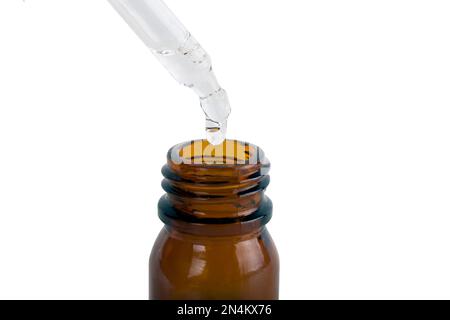 Brown medicine glass bottle with dropper isolated on white background Stock Photo