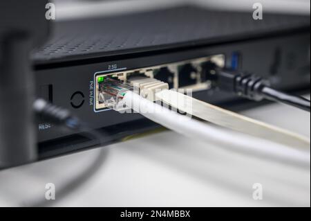 utp network cables connected in network switch on white table Stock Photo